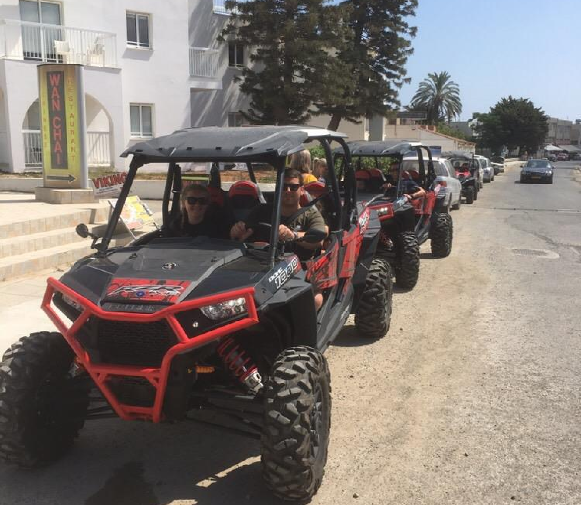 a man riding a buggy in the dessert